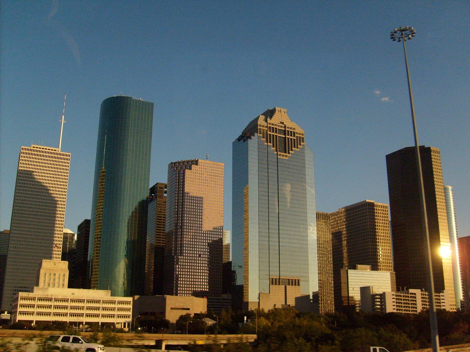 Downtown Houston skyscrapers against a clear blue sky