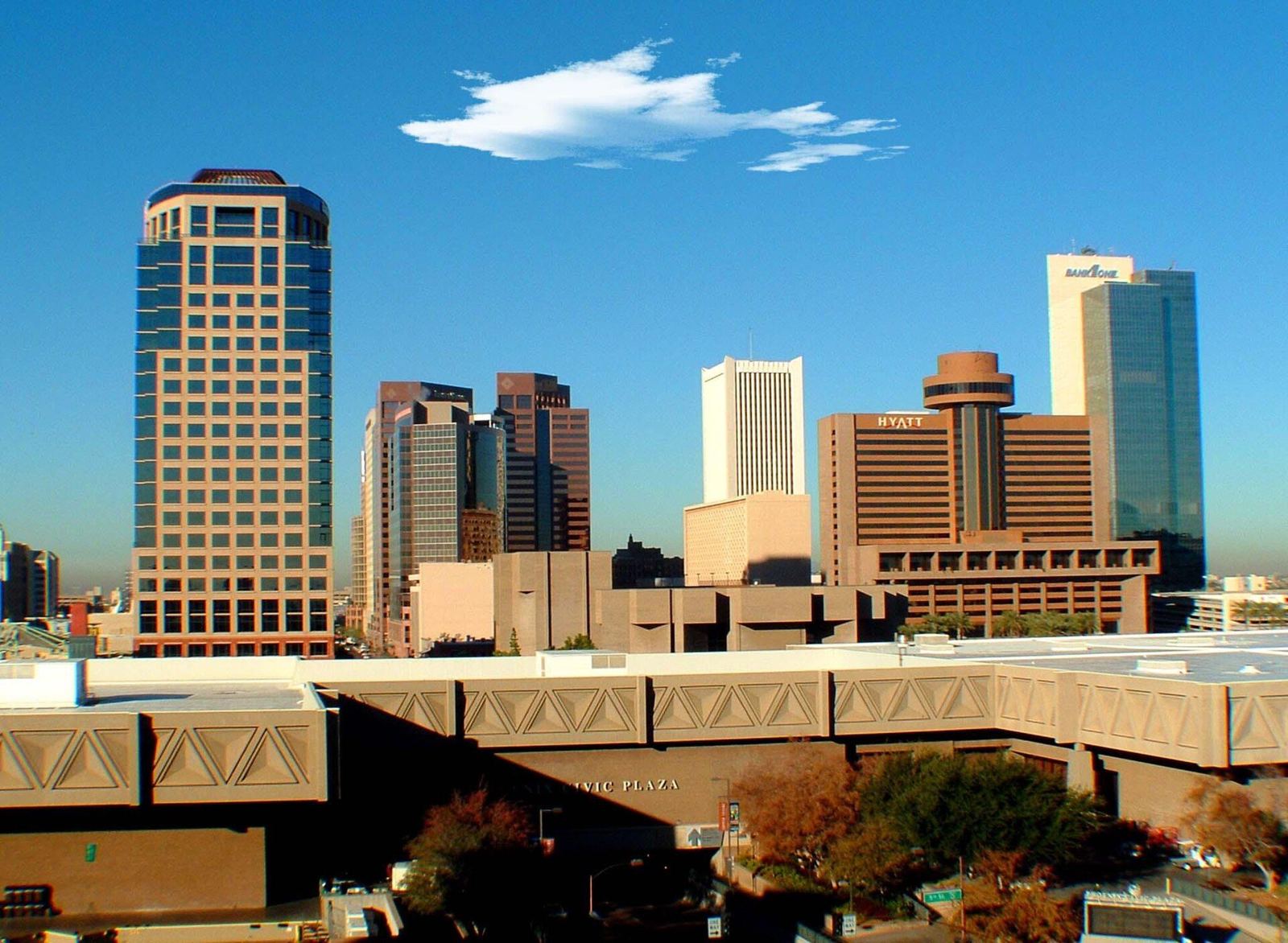 Downtown Phoenix skyline with high-rise office towers under a blue sky